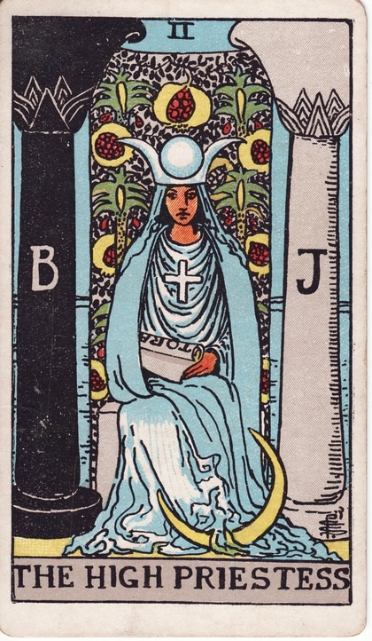High Priestess II seated between black B and white J pillars, with a pomegranate veil, TORA scroll and crescent moon.