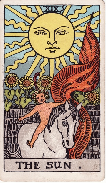The Sun XIX: a child on a pale horse beneath a large yellow sun, with a red banner, blue sky and sunflowers.